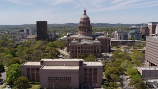 5.7K aerial stock footage reverse view of Texas State Capitol, reveal library in Downtown Austin, Texas Aerial Stock Footage | DX0002_107_019