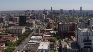 DX0002_107_040 - 5.7K aerial stock footage fly away from the city's skyline, seen from the University of Texas, Downtown Austin, Texas