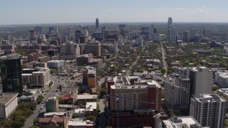 DX0002_107_042 - 5.7K aerial stock footage reverse view of the city's skyline, seen from the University of Texas, Downtown Austin, Texas