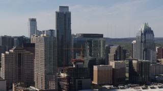 DX0002_108_031 - 5.7K aerial stock footage focus on The Austonian skyscraper and high-rise hotel during ascent in Downtown Austin, Texas