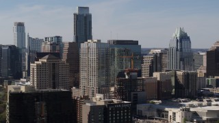 DX0002_108_033 - 5.7K aerial stock footage of The Austonian skyscraper and high-rise hotel during descent in Downtown Austin, Texas