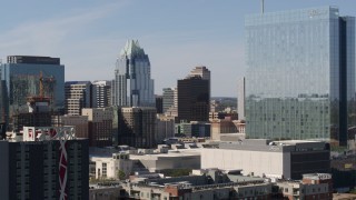 DX0002_108_036 - 5.7K aerial stock footage view of Frost Bank Tower from near high-rise hotel in Downtown Austin, Texas