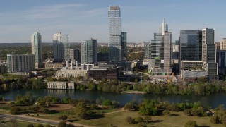 5.7K aerial stock footage modern skyscraper on the opposite side of Lady Bird Lake, Downtown Austin, Texas Aerial Stock Footage | DX0002_109_006