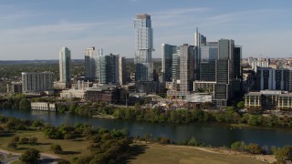 5.7K aerial stock footage modern skyscraper on the other side of Lady Bird Lake, Downtown Austin, Texas Aerial Stock Footage | DX0002_109_007