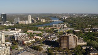 5.7K aerial stock footage a freeway bridge spanning Lady Bird Lake, descend near office building, Austin, Texas Aerial Stock Footage | DX0002_109_009