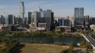 5.7K aerial stock footage flyby and away from The Northshore skyscraper on the other side of Lady Bird Lake, Downtown Austin, Texas Aerial Stock Footage | DX0002_109_011