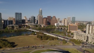 5.7K aerial stock footage a view of the city's waterfront skyline and First Street Bridge over Lady Bird Lake, Downtown Austin, Texas Aerial Stock Footage | DX0002_109_022