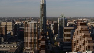 5.7K aerial stock footage of the Texas State Capitol seen while approaching The Austonian in Downtown Austin, Texas Aerial Stock Footage | DX0002_109_031