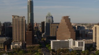 5.7K aerial stock footage flyby downtown skyscrapers and reveal the state capitol in Downtown Austin, Texas Aerial Stock Footage | DX0002_109_033