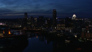 5.7K aerial stock footage a reverse view of waterfront skyline, seen from Lady Bird Lake at twilight in Downtown Austin, Texas Aerial Stock Footage | DX0002_111_005