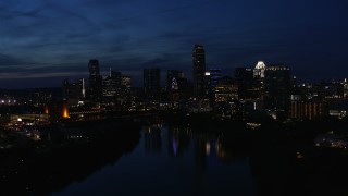 5.7K aerial stock footage slowly flyby waterfront skyline on the shore of Lady Bird Lake at twilight in Downtown Austin, Texas Aerial Stock Footage | DX0002_111_008