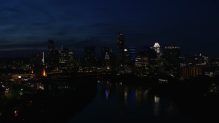 5.7K aerial stock footage city's waterfront skyline on the opposite shore of Lady Bird Lake at night in Downtown Austin, Texas Aerial Stock Footage | DX0002_111_012