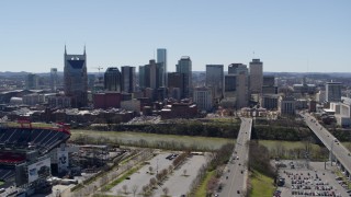 5.7K aerial stock footage focus on the city's skyline while ascending near the river in Downtown Nashville, Tennessee Aerial Stock Footage | DX0002_112_008