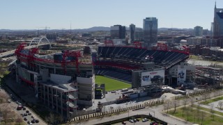 5.7K aerial stock footage of orbiting the football stadium with view of the field in Nashville, Tennessee Aerial Stock Footage | DX0002_112_010