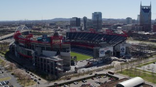 5.7K aerial stock footage of an orbit of the football stadium with view of the field in Nashville, Tennessee Aerial Stock Footage | DX0002_112_011