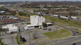 5.7K aerial stock footage of orbiting a hotel by the freeway in Nashville, Tennessee Aerial Stock Footage | DX0002_112_012