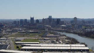 5.7K aerial stock footage a wide view of the city's riverfront skyline and Cumberland River in Downtown Nashville, Tennessee Aerial Stock Footage | DX0002_112_017