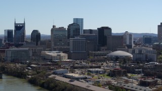 5.7K aerial stock footage of the city's skyline on the opposite side of the river, Downtown Nashville, Tennessee Aerial Stock Footage | DX0002_112_030