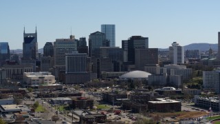 DX0002_112_035 - 5.7K aerial stock footage of ascending near the city's skyline, Downtown Nashville, Tennessee