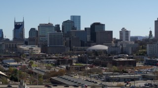 DX0002_112_036 - 5.7K aerial stock footage of descending near the city's skyline, Downtown Nashville, Tennessee