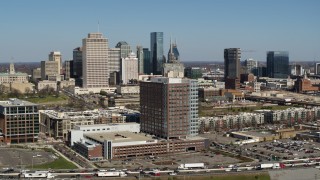 5.7K aerial stock footage descend by office building for view of city's skyline behind apartment buildings in Downtown Nashville, Tennessee Aerial Stock Footage | DX0002_113_019