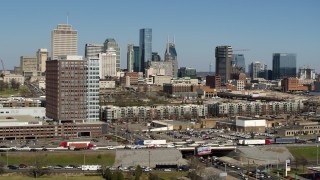 5.7K aerial stock footage flying past an office building, skyline in background, Downtown Nashville, Tennessee Aerial Stock Footage | DX0002_113_025