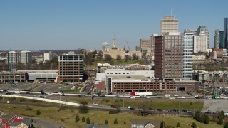 5.7K aerial stock footage of descending by office buildings in Nashville, Tennessee Aerial Stock Footage | DX0002_113_028