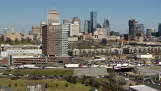 5.7K aerial stock footage descend near office building, skyline in distance, Downtown Nashville, Tennessee Aerial Stock Footage | DX0002_113_031