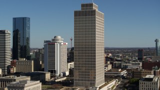 5.7K aerial stock footage of descending by Tennessee Tower in Downtown Nashville, Tennessee Aerial Stock Footage | DX0002_113_042