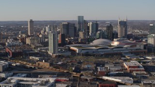 5.7K aerial stock footage stationary and passing view of convention center and skyline in Downtown Nashville, Tennessee Aerial Stock Footage | DX0002_114_015