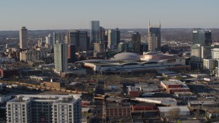 5.7K aerial stock footage approach the city skyline behind the convention center in Downtown Nashville, Tennessee Aerial Stock Footage | DX0002_114_021