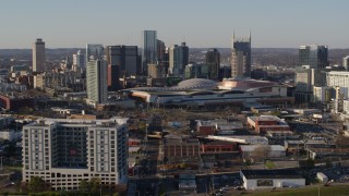 5.7K aerial stock footage of slowly flying toward the city skyline and the convention center in Downtown Nashville, Tennessee Aerial Stock Footage | DX0002_114_025