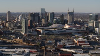 5.7K aerial stock footage of the city skyline behind the convention center during ascent in Downtown Nashville, Tennessee Aerial Stock Footage | DX0002_114_026