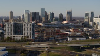 5.7K aerial stock footage of the city skyline and convention center, reveal I-65 in Downtown Nashville, Tennessee Aerial Stock Footage | DX0002_114_027