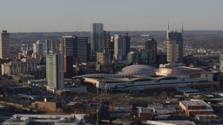 5.7K aerial stock footage of approach and orbit the convention center and city skyline in Downtown Nashville, Tennessee Aerial Stock Footage | DX0002_114_030