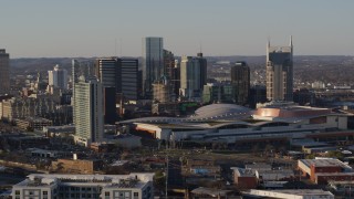 5.7K aerial stock footage of slowly past the city skyline and the convention center in Downtown Nashville, Tennessee Aerial Stock Footage | DX0002_114_032