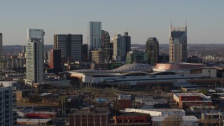 5.7K aerial stock footage of passing the city skyline and the convention center in Downtown Nashville, Tennessee Aerial Stock Footage | DX0002_114_034