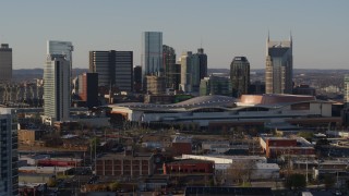 5.7K aerial stock footage flying past city's tall skyline by the convention center in Downtown Nashville, Tennessee Aerial Stock Footage | DX0002_114_035