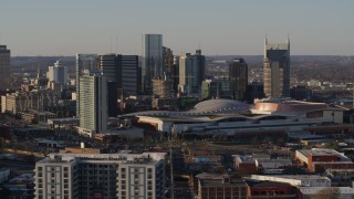 5.7K aerial stock footage slow flight by city's tall skyline, Nashville Music City Center in Downtown Nashville, Tennessee Aerial Stock Footage | DX0002_114_041