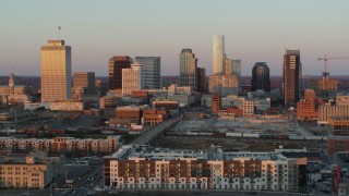 5.7K aerial stock footage of slowly flying by the city's skyline at sunset in Downtown Nashville, Tennessee Aerial Stock Footage | DX0002_115_003