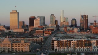 5.7K aerial stock footage approach Church Street, ascend for view of city's skyline at sunset in Downtown Nashville, Tennessee Aerial Stock Footage | DX0002_115_005