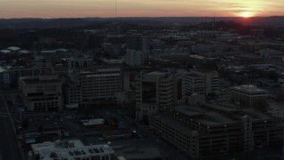 5.7K aerial stock footage approach hospital complex and ascend with view of setting sun, Nashville, Tennessee Aerial Stock Footage | DX0002_115_017