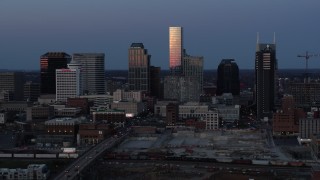 5.7K aerial stock footage of flying by the city's skyline at twilight in Downtown Nashville, Tennessee Aerial Stock Footage | DX0002_115_020