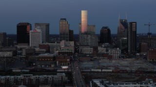 5.7K aerial stock footage of passing by Church Street and the city's skyline at twilight in Downtown Nashville, Tennessee Aerial Stock Footage | DX0002_115_021