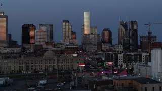 5.7K aerial stock footage descend and flyby Church Street with view of city's skyline at twilight in Downtown Nashville, Tennessee Aerial Stock Footage | DX0002_115_022