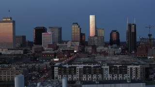 5.7K aerial stock footage the city's skyline seen while ascending past apartments at twilight in Downtown Nashville, Tennessee Aerial Stock Footage | DX0002_115_024