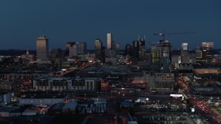 5.7K aerial stock footage wide view of the city skyline and high-rise under construction at twilight, Downtown Nashville, Tennessee Aerial Stock Footage | DX0002_115_033