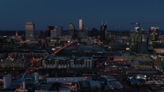 DX0002_115_034 - 5.7K aerial stock footage wide view of the city skyline, high-rise under construction at twilight, Downtown Nashville, Tennessee