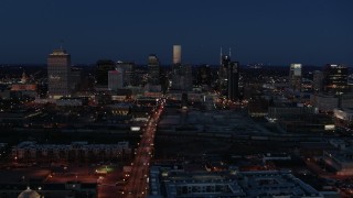 5.7K aerial stock footage reverse view of Church Street and city skyline at twilight, Downtown Nashville, Tennessee Aerial Stock Footage | DX0002_115_036