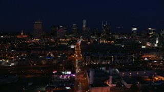 DX0002_115_050 - 5.7K aerial stock footage flying by Church Street and the city skyline at night, Downtown Nashville, Tennessee